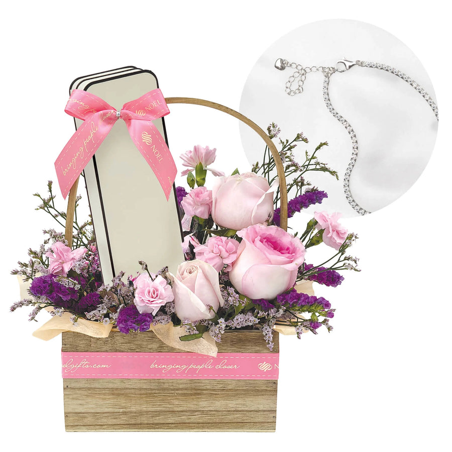 Charm Jewelry Gift with silver bracelet, pink flowers and wooden basket