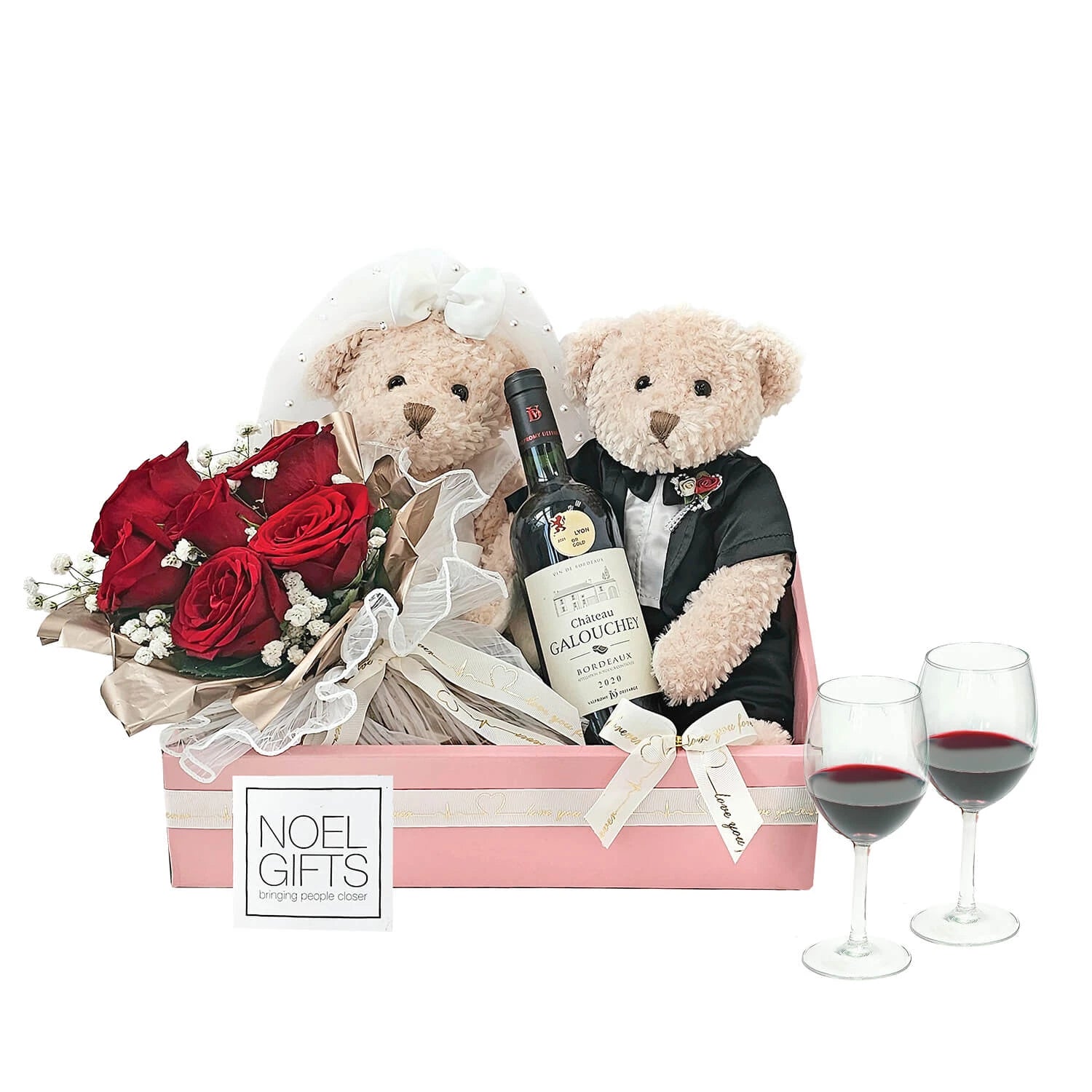 Gift set with teddy bears, flowers, a bottle of wine, and glasses on a white background.