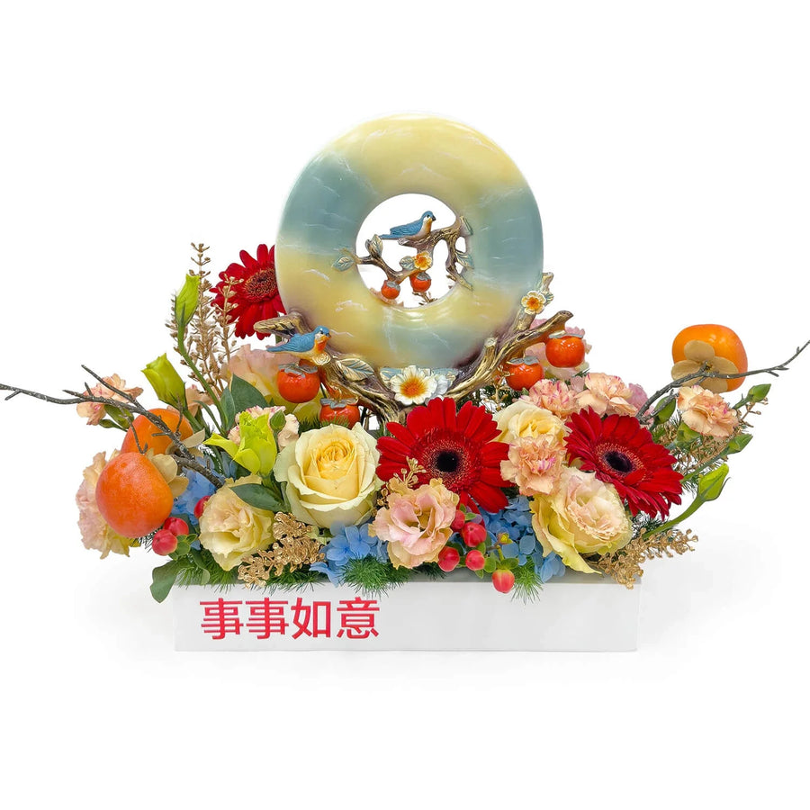 Wishes in Bloom congratulatory table flower arrangement with roses and gerbera flowers
