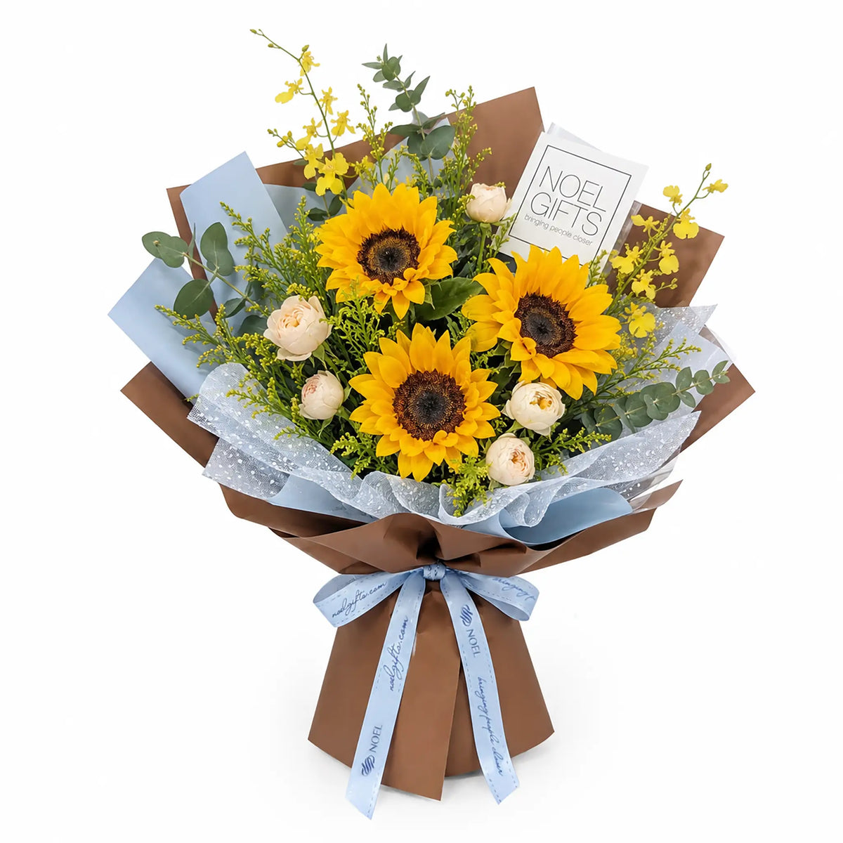 Blue Skies Classic Hand Bouquet featuring 3 sunflowers, champagne spray roses, yellow Oncidium orchids, Callistemon hybridus and eucalyptus foliage in blue and warm brown wrapping with a light blue ribbon | Noel Gifts