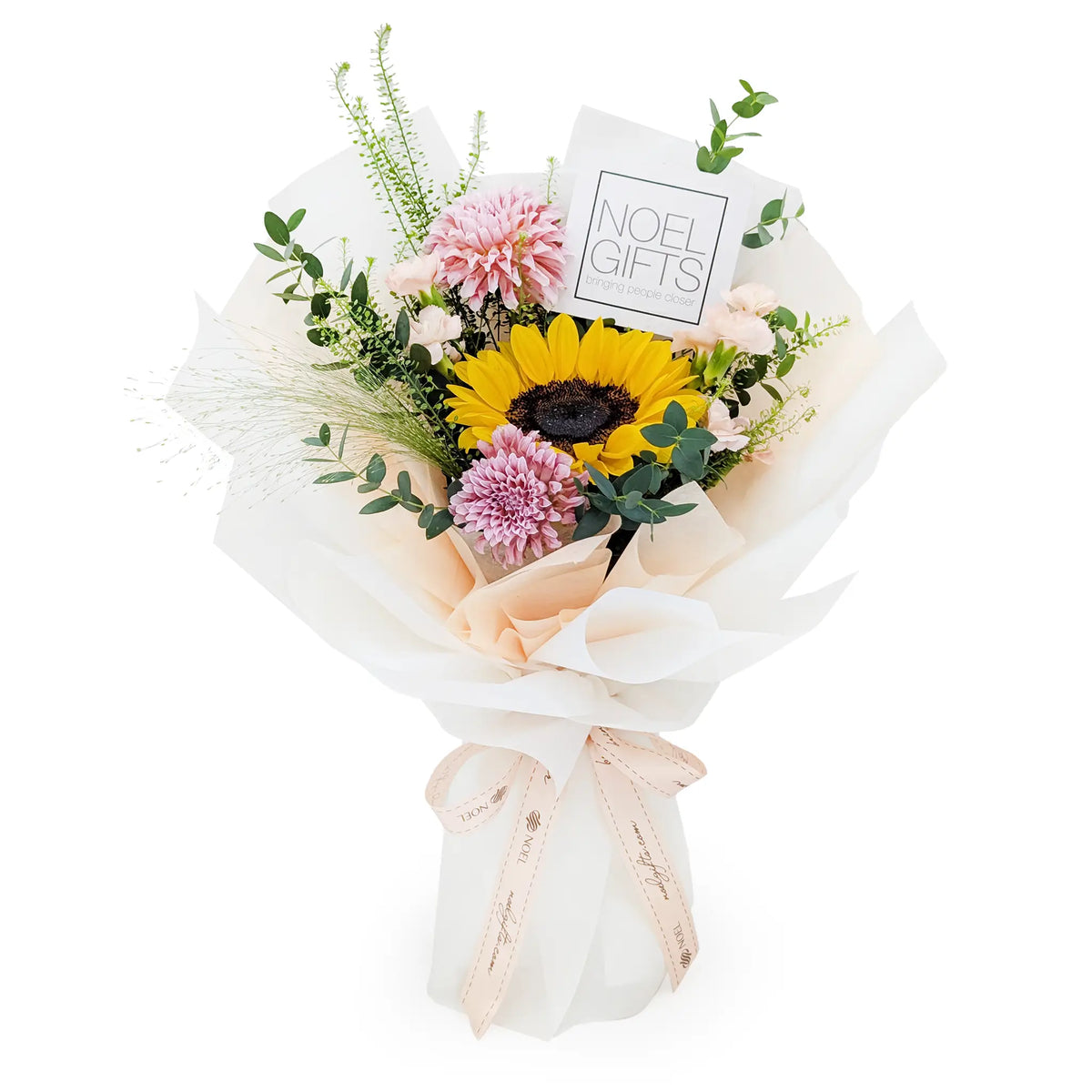 You Are My Sunshine Petite Hand Bouquet featuring a golden sunflower, cream peach dahlia, champagne spray carnations, eucalyptus, Lepidium and mountain grass in cream wrapping | Noel Gift