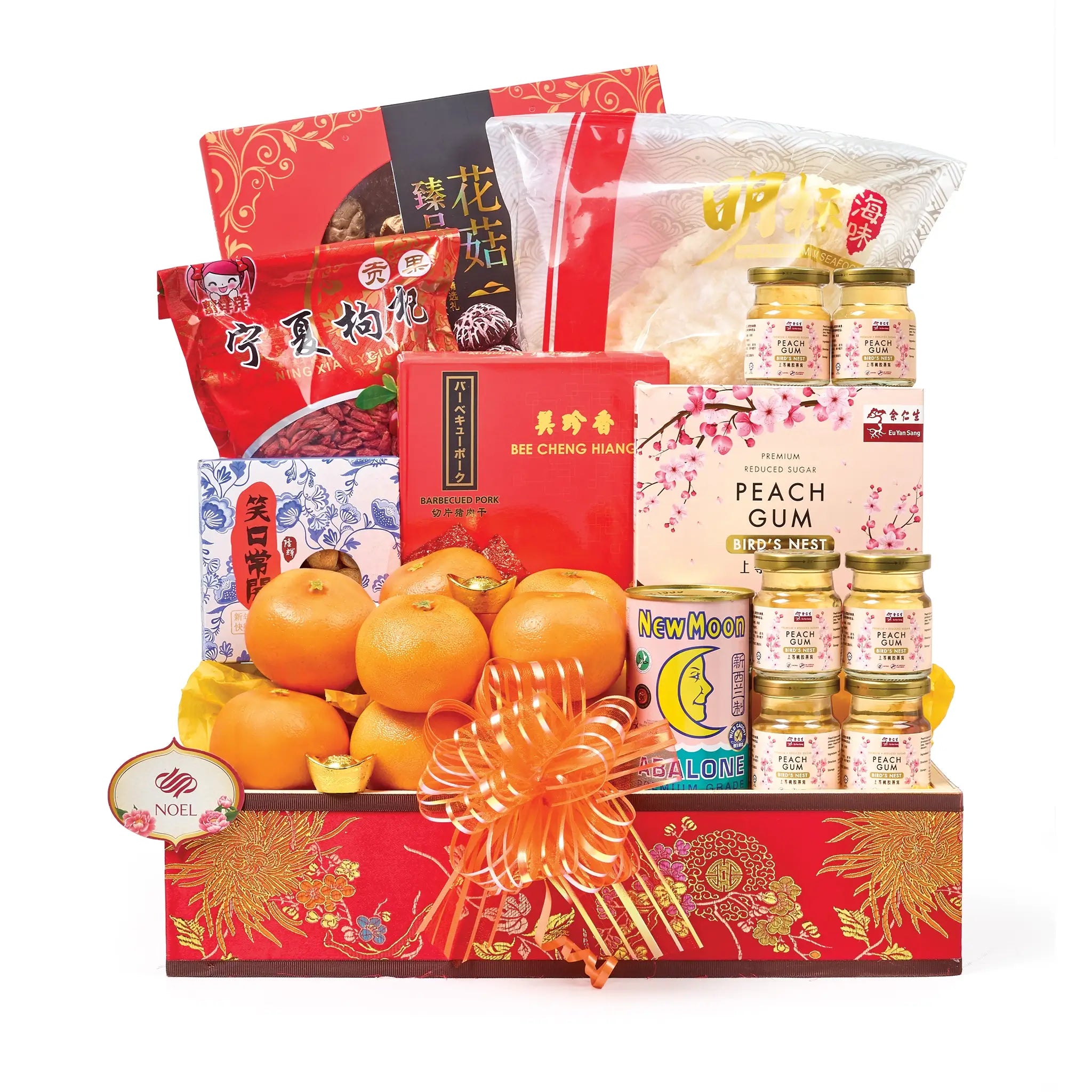 Chinese New Year gift hamper with New Zealand abalone, Eu Yan Sang peachgum bird’s nest, fish maw, dried scallops, mushrooms, pork slices, wolfberries, and mandarin oranges.